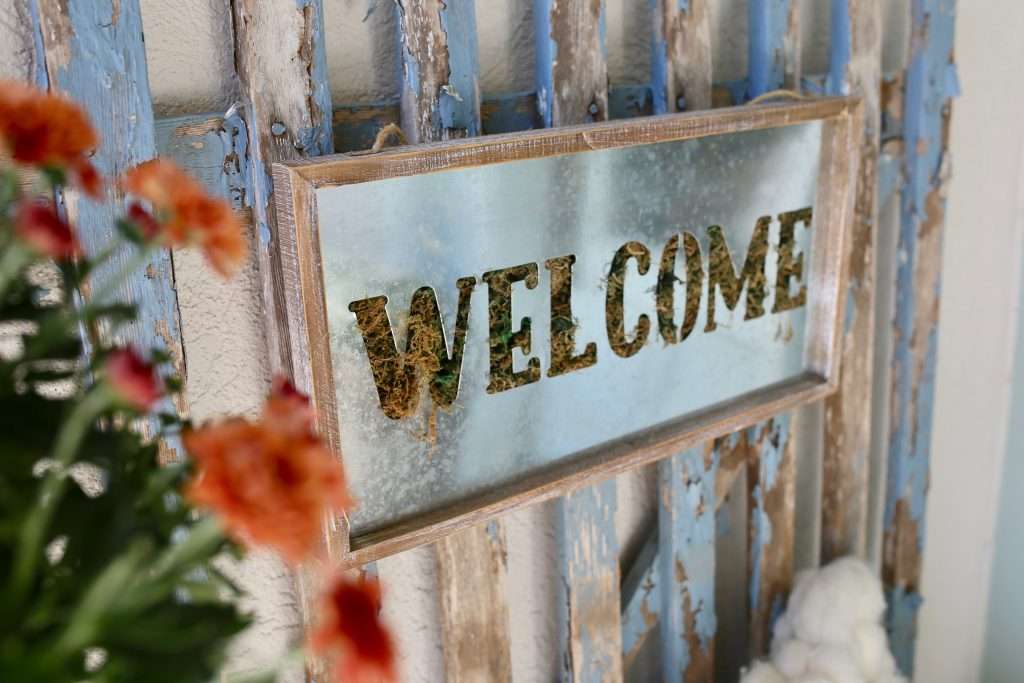 welcome sign layered on vintage gate for fall welcome sign layered on vintage gate for fall