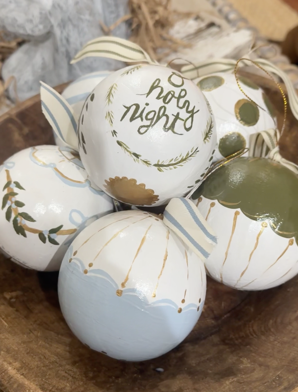 painted Paper mâché christmas ornaments in a wooden bowl for a cozy christmas